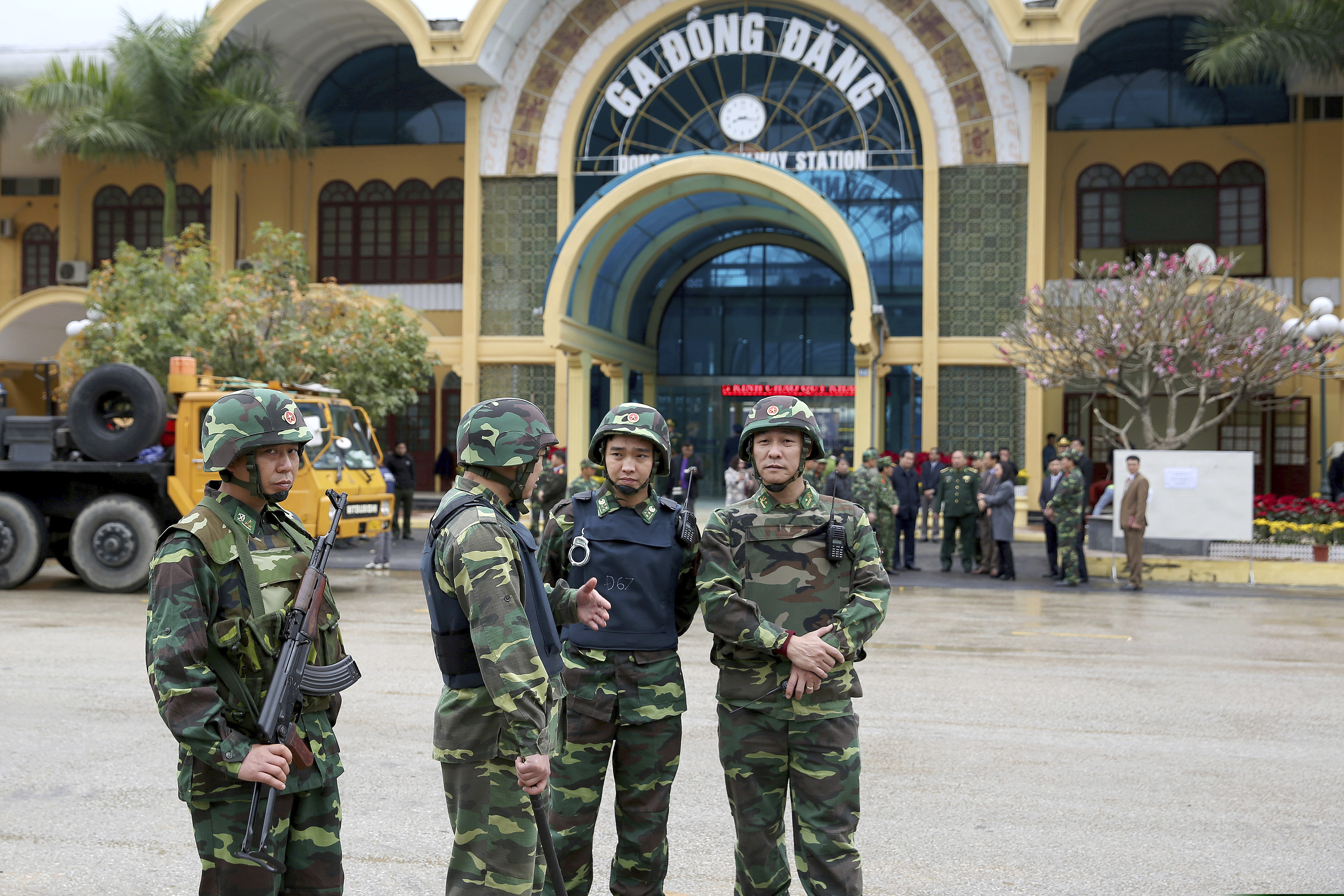 Vietnamese soldiers stand guard at the entrance to Dong Dang train station where North Korean leader Kim Jong Un is expected to arrive at the border town with China, in Dong Dang, Lang Son province, Vietnam, Monday, Feb. 25, 2019. The second summit between U.S. President Donald Trump and North Korean leader Kim Jong Un will take place in Hanoi on Feb. 27 and 28. (AP Photo/Minh Hoang)