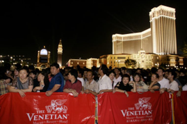 A crowd waited for the opening Tuesday of the Venetian Macao Resort Hotel. Las Vegas Sands, which is funding the new casino, said it believed Chinese patrons' big appetite for gambling would make Macao the gaming-retail-convention capital of the Far East.