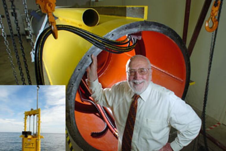 George W. Taylor, Founder and CEO of Ocean Power Technologies, in front of a spar from a PB 40 being built at the company's plant in Pennington, NJ. The spar holds all the high-tech equipment which generates electricity from the motion of waves (inset). (Clem Murray / Inquirer)