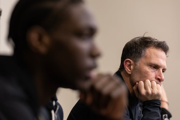 Rasheer Fleming, left, and coach Billy Lange of St. Joseph's in their press conference following their loss to VCU in a semifinal game in the Atlantic 10 Basketball Tournament on March 16, 2024.