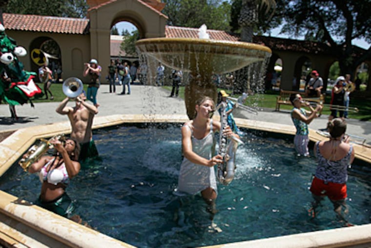 Eva Glasrud, center, a student at Stanford University, and other members of Stanford's band perform during a fountain rally on May 22. (Patrick Tehan / San Jose Mercury News/MCT)