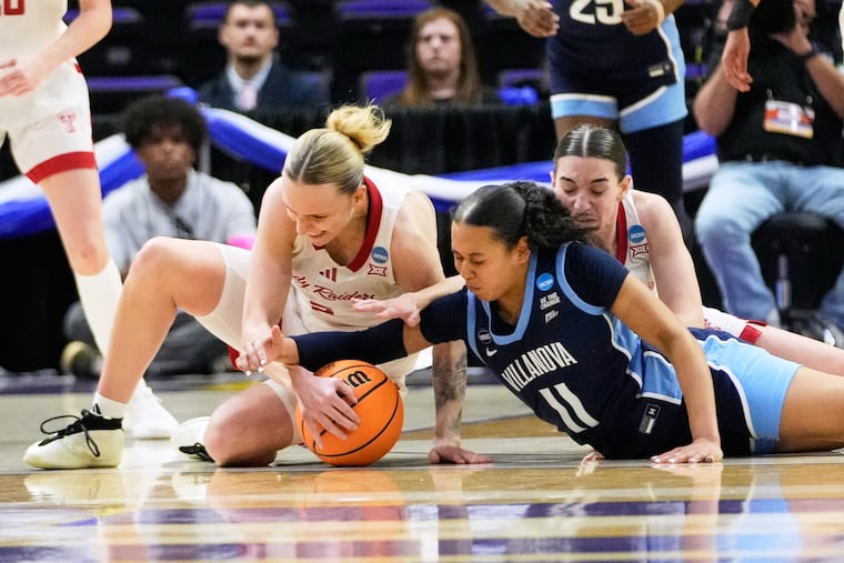 Villanova guard Jasmine Bascoe (11) and Texas Tech guard Denae Fritz battle for a loose ball during the second half on Friday in Baton Rouge, La. This was a common scene between two teams that emphasize tough defense.