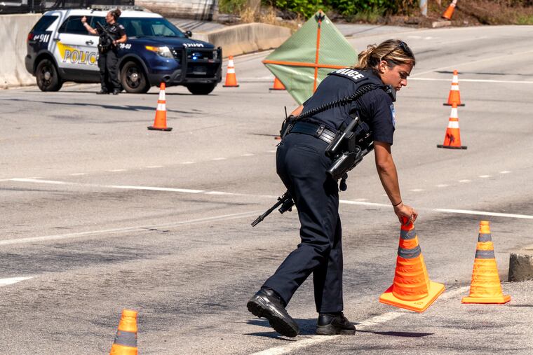 Police work a closed road and check-point for vehicles leaving the perimeter Tuesday, Sept.12, 2023 as the search for escaped convict Danilo Cavalcante continues in northern Chester County his at the intersection of the Pottstown Pike (Rt. 100) and Ridge Road (Rt.23) in Pughtown, South Coventry Township.
