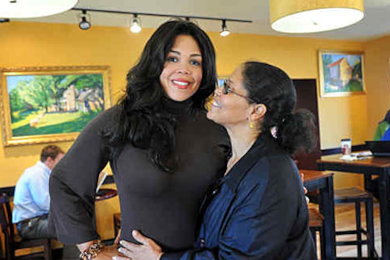 Khaliah Ali (left), daughter of Muhammad Ali, with her mother, Aaisha Fletcher in Haverford. Ali "will be treated like a queen" in the Democratic Republic of Congo, said Noella Coursaris Musunka, a model and activist who asked her to travel to the former Zaire. (Sharon Gekoski-Kimmel / Staff)