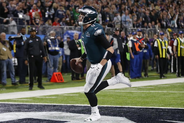 Nick Foles runs untouched into the end zone on a trick play, a pass from Trey Burton.