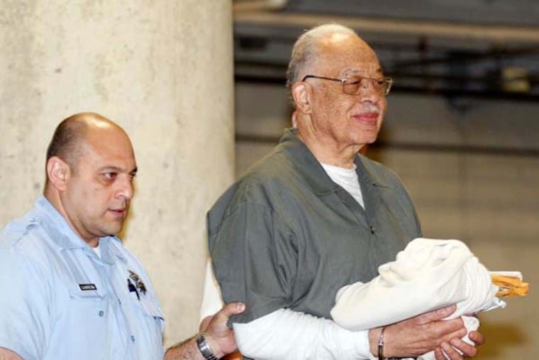 Dr. Kermit Gosnell gets escorted to a van leaving the Criminal Justice Center after getting convicted on three counts of first degree murder on Monday, May 13, 2013. ( Yong Kim / Staff Photographer )
