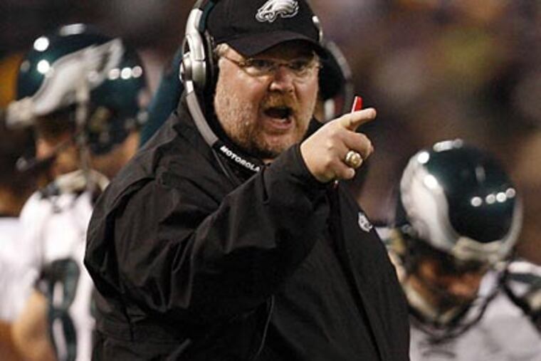 "I am not looking ahead a lick," Eagles coach Andy Reid said after his team beat the Vikings to set up a second-round playoff date with the Giants. (David Maialetti / Staff Photographer)