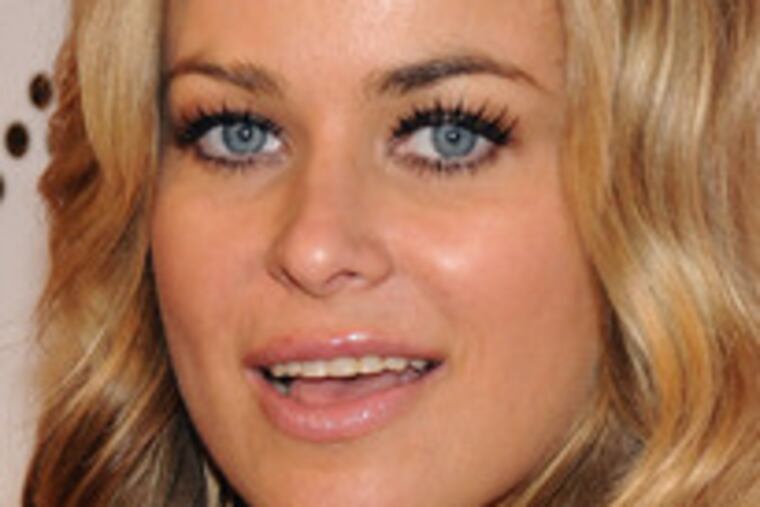 Carmen Electra's finger is electrified with a black diamond set in white ones.