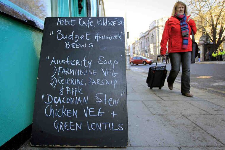 A Dublin cafe takes note of the economic crisis. On Tuesday, legislators narrowly backed a budget with $8 billion in cuts and tax increases costing a typical household $4,000 a year - key conditions for an EU/IMF bailout.