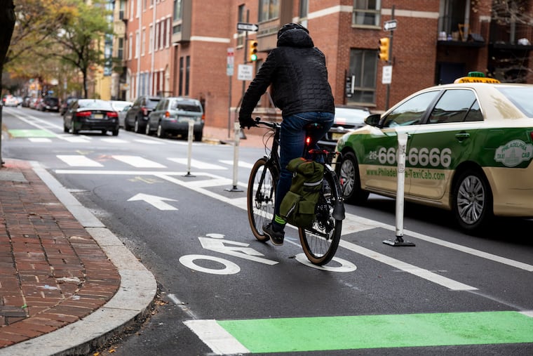 Clearly designated lanes with flex posts, like these in Society Hill, make it safer for bicyclists to share the road with cars in Philadelphia.