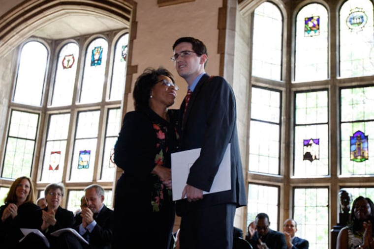 JoAnne Epps, dean of the Temple Law School, with Anthony Foltz, who was honored in 2011 for overcoming adversity. Epps, who became dean in 2008, has guided the school through some challenging times. (DAVID MAIALETTI/Staff Photographer)