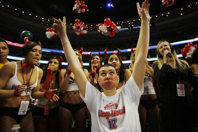 Jonathan Squibb of Berlin, N.J., aka Super Squibb, celebrates a successful first round of wing eating on his way to winning Wing Bowl 17 and a new car. He demolished 203 wings as well as the competition. (Alejandro Alvarez / Staff Photographer)