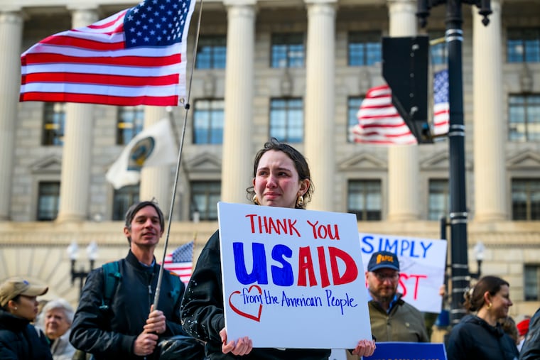 USAID employees leave the agency’s former offices at the Ronald Reagan Building and International Trade Center with their personal effects on Feb. 28, 2025.