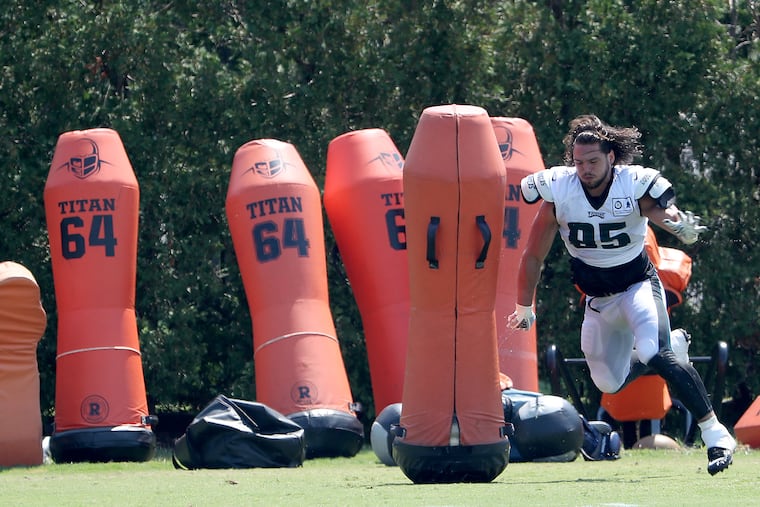 Joe Ostman works out after Eagles training camp Tuesday.