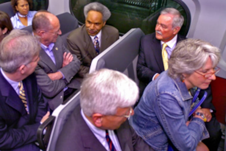 Five suburban Philadelphia mayors share a ride on SEPTA's regional rail line with Mayor Street. Clockwise from Street, they are Norm Hawkes of Hatboro, Jayne Young of Lansdowne, Bud Wahl of Ambler, Tom Grady of Narberth, and Dick Yoder of West Chester.