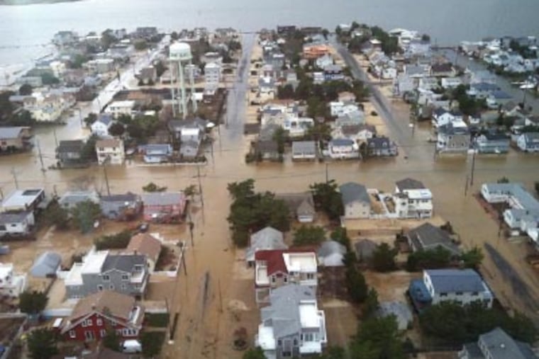 An aerial view of Brant Beach in Long Beach Island, N.J., where the bay met the ocean during Hurricane Sandy on Monday (Troy J. Graham / Staff). <a href="http://www.philly.com/philly/gallery/Helicopter_Views_of_Shore_Devastation.html"><B>View more aerial photos of shore devastation.</b></a>