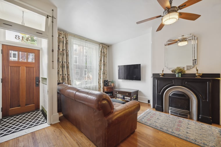 The tile in the vestibule was designed by the homeowners, who renovated much of the home over 14 years.