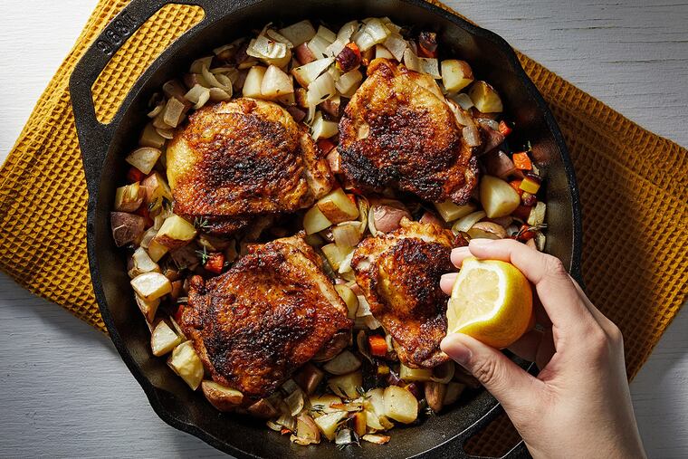 Skillet-Roasted Chicken Thighs with Potato-Carrot Hash.