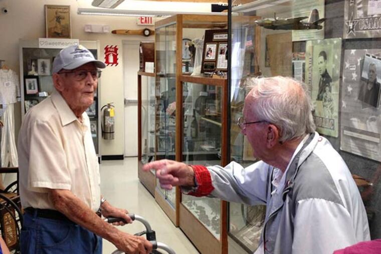 Bill Hogan (left) and Dan Theokas were held in the same German POW camp during World War II. Hogan was leading a tour when the two met for the first time in Millville, N.J. (Photo courtesy Bob Trivellini, vice president of the board of the Millville Army Airfield Museum at Millville Airport)