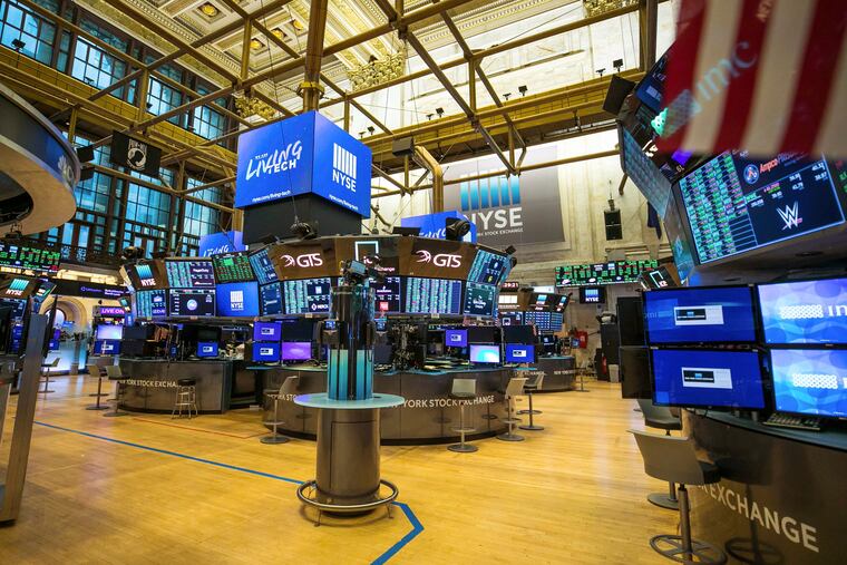 An unoccupied New York Stock Exchange trading floor in March, closed for the first time in 228 years because of the coronavirus.