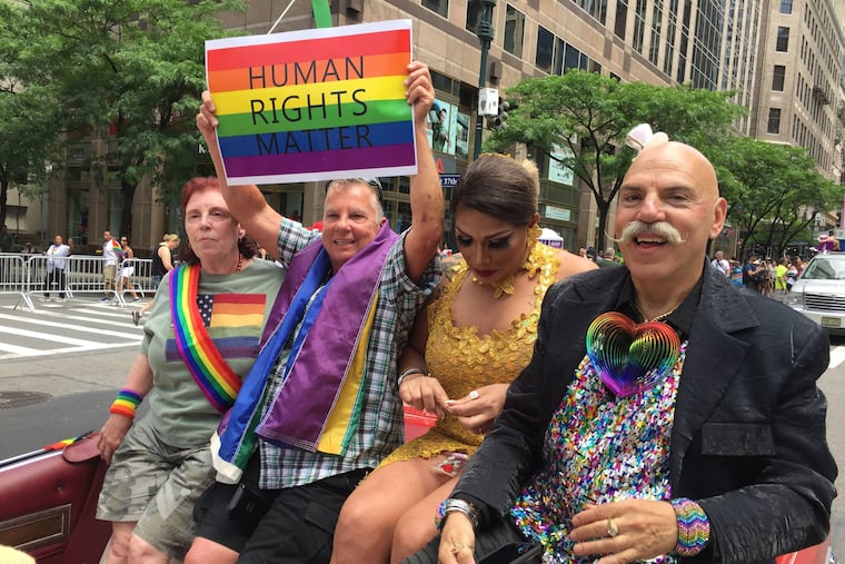 Henri David (far right) rides in the Stonewall car, leading the Pride parade in 2017, commemorating the 48th anniversary of Stonewall.