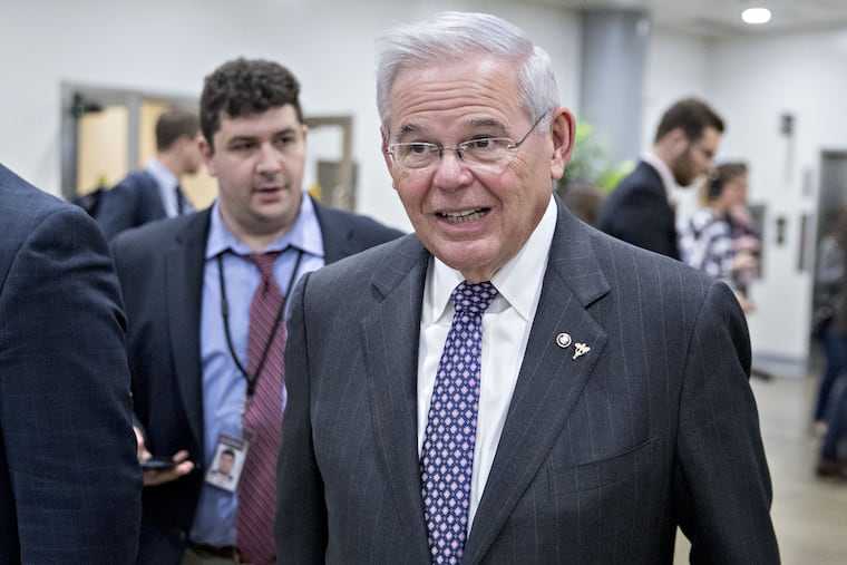 Sen. Robert Menendez, D-N.J., walks through the basement of the U.S. Capitol in Washington on Nov. 28, 2017.