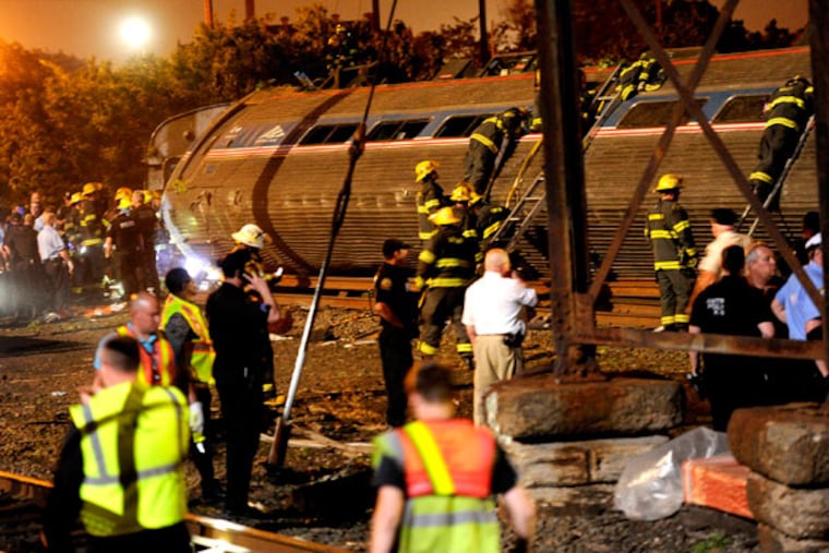 After Train 188 derailed, rescue operations had to focus not only on saving survivors and searching for victims, but on comprehending the steps families would take to find loved ones, and managing the needs of first responders. (TOM GRALISH / Staff Photographer)