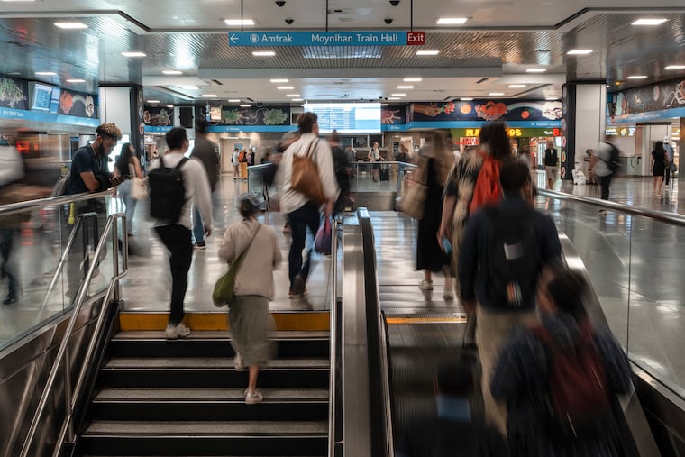 FILE — Passengers at Pennsylvania Station in New York, Aug. 6, 2025. President Donald Trump has made revitalizing the cramped train hall a priority, but he will need the cooperation of a transit agency his administration has long criticized.