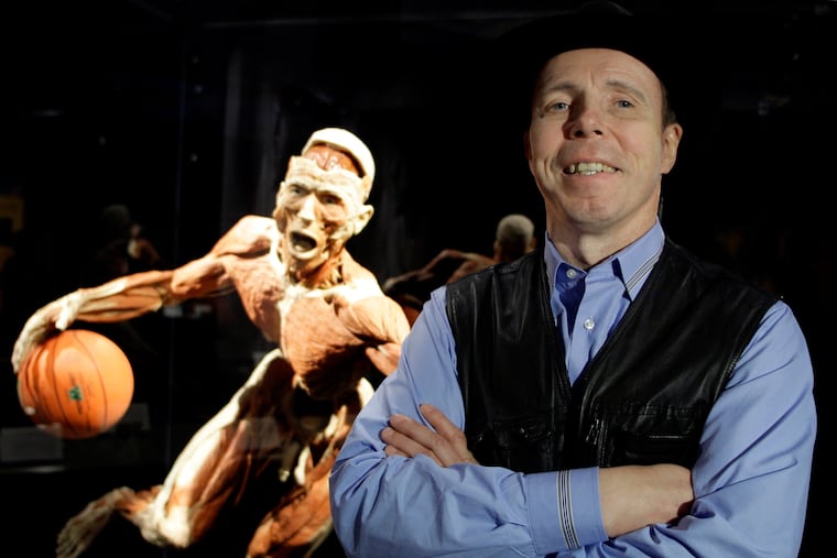 Gunther von Hagens, anatomist, inventor, and creator of "Body Worlds The Original Exhibitions of Real Human Bodies," known as Germany's "Dr Death," is seen with one of his works in Istanbul, Turkey, Friday, June 11, 2010.