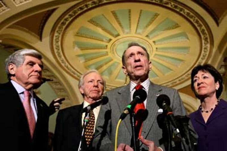 Sen. Arlen Specter talks about the Senate's work to pass the economic stimulus bill as Sen. Joe Lieberman, Sen. Ben Nelson and Sen. Susan Collins (left to right) listen in Washington on Friday. (J. Scott Applewhite/AP Photo)