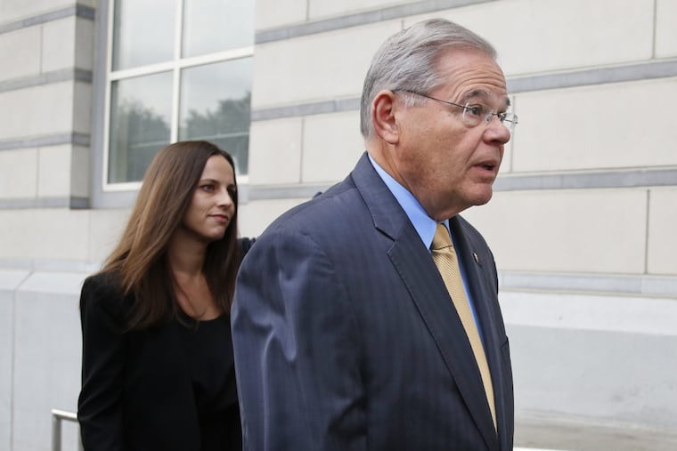 Sen. Bob Menendez arrives with daughter Alicia at court in Newark, N.J.