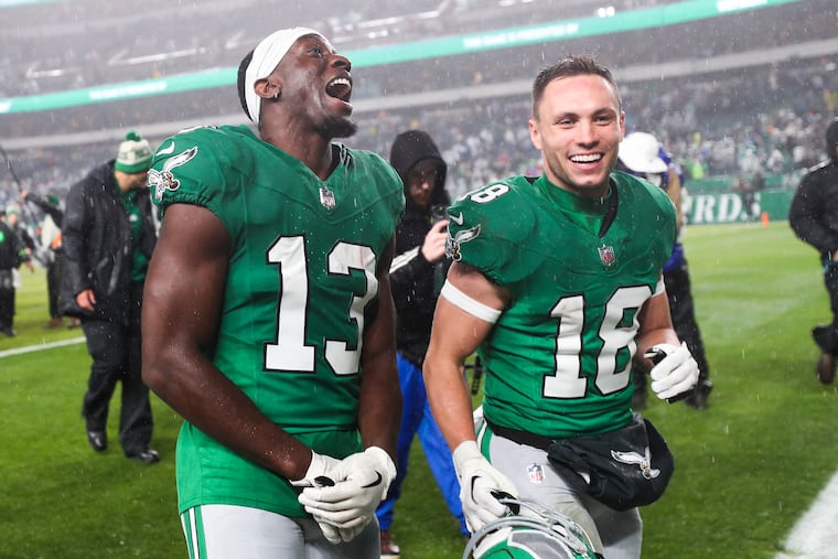 Philadelphia Eagles wide receiver Olamide Zaccheaus and Philadelphia Eagles wide receiver Britain Covey celebrate after an overtime win over the Buffalo Bills at Lincoln Financial Field in Philadelphia on Sunday, Nov. 26, 2023.