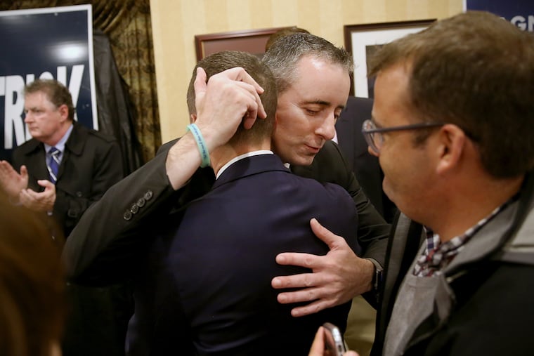 Rep. Brian Fitzpatrick, center right, hugs supporter Torrey Shearer of the American Unity Fund after Fitzpatrick was re-elected during the Bucks County GOP watch party in Doylestown, Pa., on Tuesday, Nov. 6, 2018.