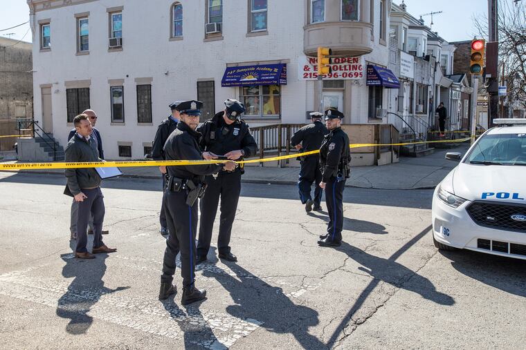 Philadelphia police investigate after two men were shot outside P&P Sunnyside Academy III at 54th Street and Girard Avenue in West Philadelphia on Wednesday, March 4, 2020.