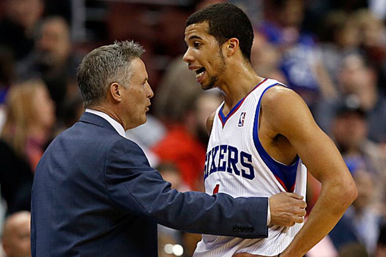 76ers head coach Brett Brown and point guard Michael Carter-Williams. (Yong Kim/Staff Photographer)