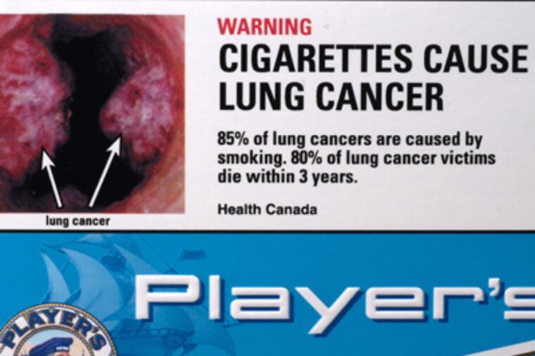 New graphic warning labels on cigarettes, such as this one from Canada, will help counter the tobacco industryâs advertising. (Pierre Roussel / Newsmakers)
