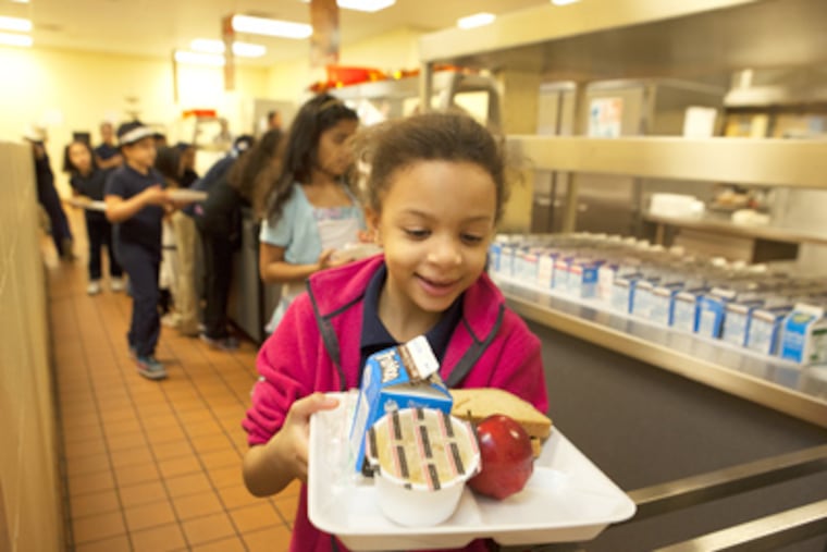 Third grader Nia Sosa-Abreu looks over her lunch selection at Juniata Park Academy. ( ED HILLE / Staff Photographer