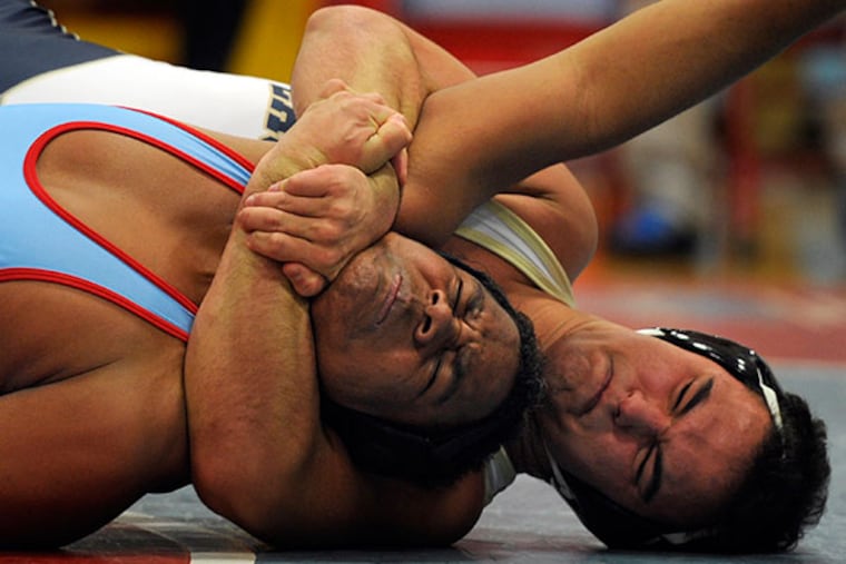 La Salle College High School's Anthony Piscopo
(right) has Father Judge's Sean Armstrong (left). (Tom Gralish/Staff Photographer)
