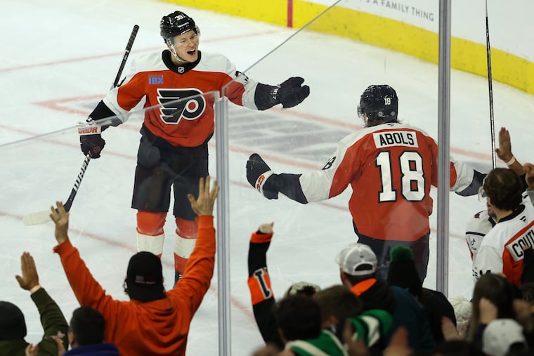 Flyers' Malvei Michkov (left) celebrates his second goal against the Capitals on Thursday night.