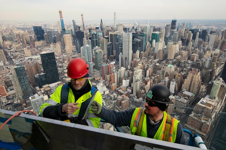 In this March 8, 2019, file photo, work continues on an outdoor observation deck on the 30 Hudson Yards office building in New York. Moodys economist Mark Zandi believes the odds favor a doubledip recession when the next president is sworn in. (AP Photo/Mark Lennihan, File)