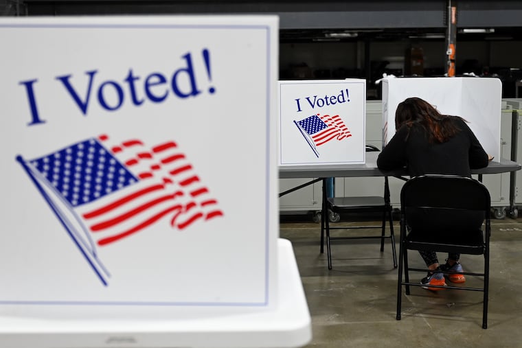 A voter at the Camden County Elections and Archive Center in Blackwood, N.J., Oct. 27, 2021.