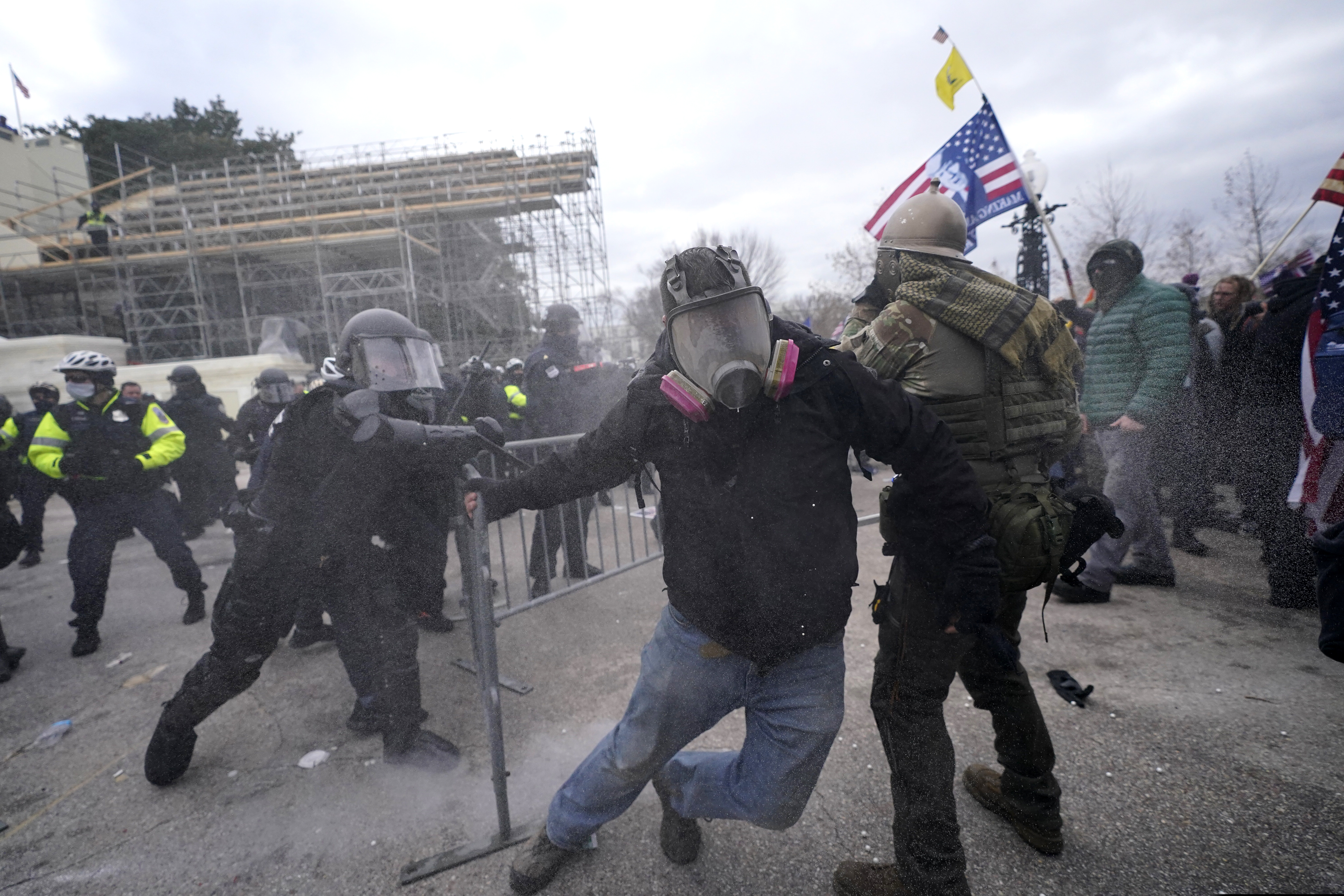Trump supporters try to break through a police barrier Wednesday at the Capitol in Washington.