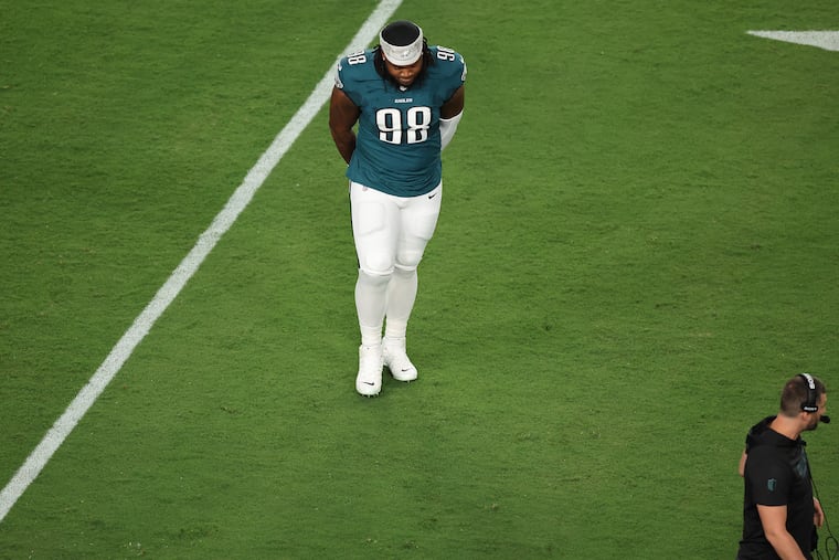 Jalen Carter walks off the field after he was ejected from Thursday's game.