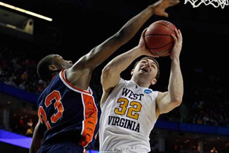 Bucks County native Dalton Pepper (32) and West Virginia take on Duke in tonight's Final Four matchup. (AP Photo/David Duprey)