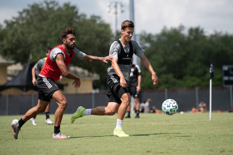 Matej Oravec, right, dribbling the ball away from Matthew Real during a Philadelphia Union practice session during the MLS Is Back Tournament on July 16at Disney World's ESPN Wide World of Sports near Orlando, Fla.