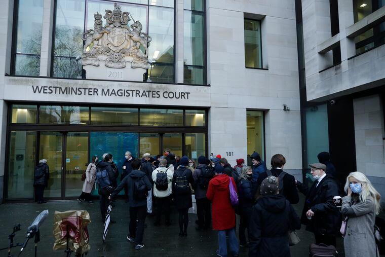 Julian Assange supporters and members of the media queue up outside Westminster Magistrates Court to get a seat at his Bail hearing in London, Wednesday, Jan. 6, 2021. On Monday, Judge Vanessa Baraitser ruled that Julian Assange cannot be extradited to the US. because of concerns about his mental health. Assange had been charged under the US's 1917 Espionage Act for "unlawfully obtaining and disclosing classified documents related to the national defence". Assange remains in custody, the US. has 14 day to appeal against the ruling.