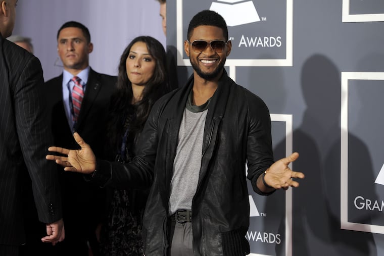 Usher arrives at the 53rd annual Grammy Awards on Sunday, Feb. 13, 2011, in Los Angeles.