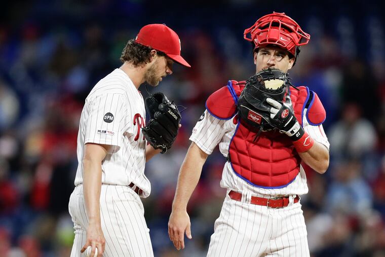 Phillies starter Aaron Nola and catcher J.T. Realmuto during the game against the Milwaukee Brewers on May 13.