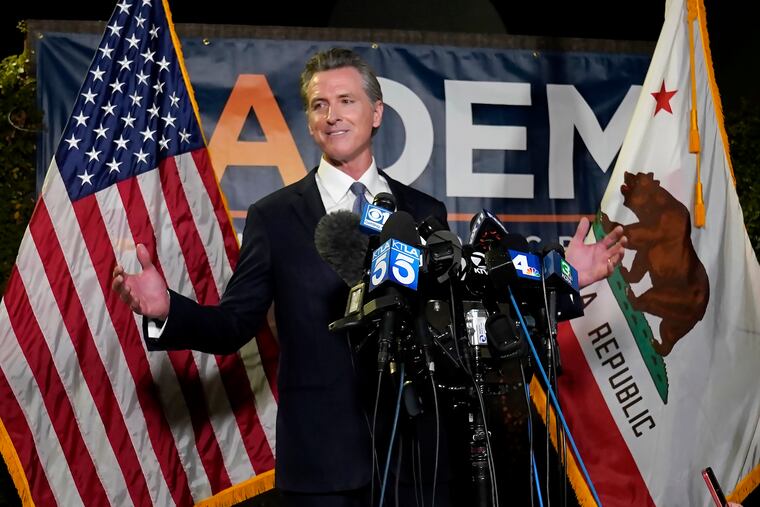 California Gov. Gavin Newsom addresses reporters after beating back the recall attempt that aimed to remove him from office on Tuesday.