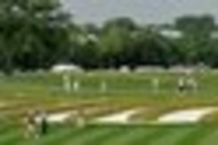 This bunker arrangement at Oakmont, which separates the third and fourth fairways, is called the "church pews." Oakmont's broad vista is party due to the recent removal of thousands of trees.